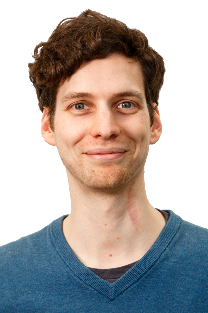 Photography of Andreas Knote, male, smiling, slightly curly brown hair, grey-green eyes.